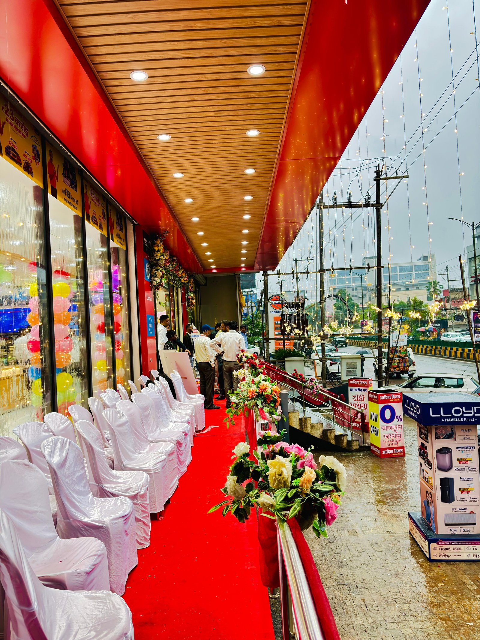 Store launch entrance with red carpet, flowers and fairy lights